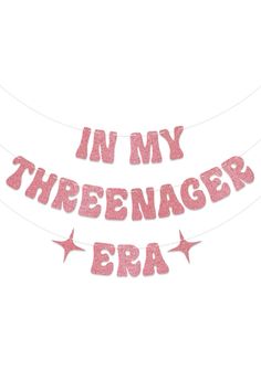 a pink banner that says in my threemagers era with stars hanging from it