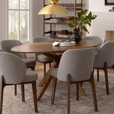 a dining room table with six chairs around it