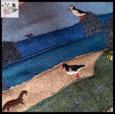 two birds are standing on the edge of a rug