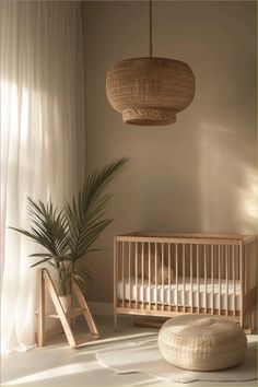 a baby crib next to a potted plant