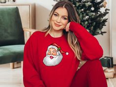 d8080881-2071-4964-accd-754a0bff7f2d Festive Long Sleeve Tops For New Year, Red Holiday Sweatshirt For Winter, Red Winter T-shirt, Cozy Christmas Tops With Relaxed Fit, Cozy Relaxed Fit Christmas Tops, Cozy Red Holiday Tops, Winter Holiday Relaxed Fit Tops, Relaxed Fit Winter Holiday Tops, Winter Holiday Tops With Relaxed Fit