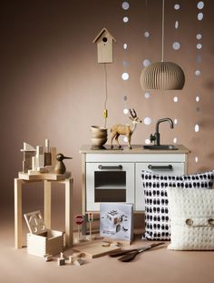 an assortment of decorative items displayed in front of a brown wall with white polka dots