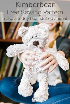 a woman sitting on the floor holding a white teddy bear with text overlay that reads, free sewing pattern make a teddy bear stuffed animal