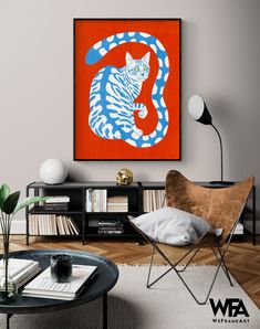 a living room with an orange and blue painting on the wall