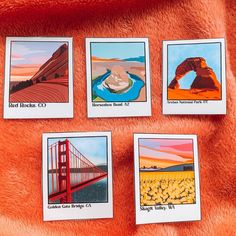 four cards with pictures of the golden gate bridge and other things in them on a red blanket