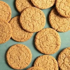 a bunch of cookies that are sitting on a table together in front of each other