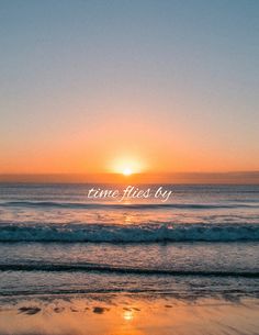 the sun is setting over the ocean with waves crashing in front of it and an inscription that reads time flies by