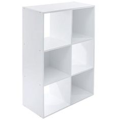 a white bookcase with four shelves on each side