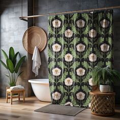 a bath room with a tub and a shower curtain on the wall next to a potted plant