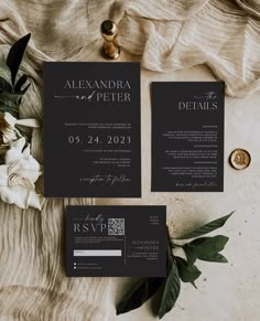 two black and white wedding stationery with flowers