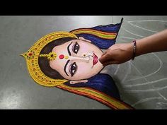 a woman's face is painted on the floor