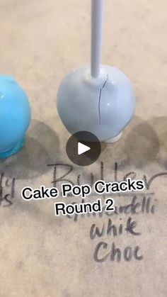 two cake pops are sitting next to each other on the ground with words written below them