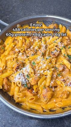 a pan filled with pasta and meat covered in sauce