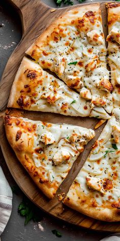 a sliced pizza on a wooden cutting board