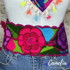 Color it up with one of our beautiful Mexican Belts for a chic western look. Made of 100% cotton with adjustable tie straps. Can be tied to the side, back or front. All belts are hand made and each design is unique. Available in two floral designs and solids. See our collection of belts here. Color is based on trim. Match it with one of our other Mexican Accessories: Espadrilles, Necklace, Shawl or Mexican Clutch. Perfect for any Mexican Themed party celebration. MEASUREMENTS: 4" Wide x 33" Long Spring Festival Fabric Belt, Embroidered Belt For Summer Beach, Summer Beach Embroidered Belt, Adjustable Belts For Spring Festival, Bohemian Multicolor Belts For Spring, Casual Embroidered Belt For Spring, Mexican Belts, Mexican Belt, Mexican Accessories