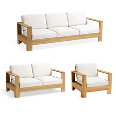 two wooden couches with white cushions on them