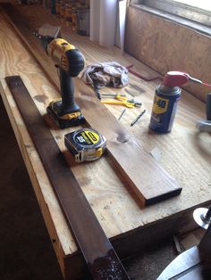 tools are sitting on top of a wooden table