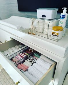 an organized drawer in a bathroom with toiletries