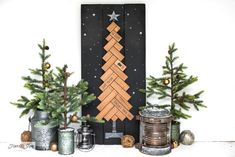 a christmas tree made out of wooden pieces on top of a mantle with tin cans