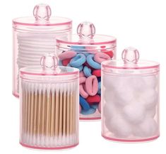 three clear containers filled with lots of different colored objects