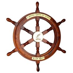 a wooden steering wheel with engraved labels on it