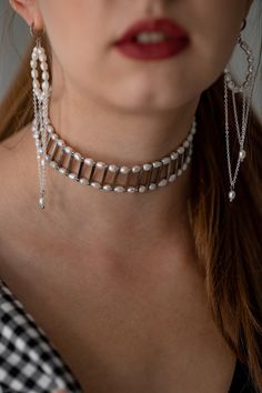 The choker is made of 2 rows of natural freshwater pearls and metal fittings in the form of sticks. The silver-colored fittings are made of jewelry stainless steel and brass. The choker will be a great gift for your girlfriend, wife, sister and yourself. Buy it for birthday, anniversary, graduation and wedding. JUST ONE SUCH NECKLACE QUALITY The high-quality materials I use in my jewelry are truly exceptional. They are carefully selected by me and come from trusted suppliers with whom I have a good relationship. Their timeless beauty and elegance make them an essential component of any jewelry collection. Whether it's a classic pearl necklace or a contemporary design, my high-quality pearls add sophistication and luxury to any outfit. View my entire shop here: https://www.etsy.com/shop/Tor White Metal Pearl Choker Necklace, Metal Pearl Drop Choker Necklace, Sterling Silver Pearl Chain Necklace For Party, Elegant Metal Pearl Choker Necklace, Metal Pearl Charm Choker Necklace, Silver Pearl Bracelet With Pearl Charm For Party, Silver Pearl Chain Choker, Elegant Silver Choker With Pearl Pendant, Silver Choker With Pearl Drop