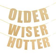 two buntings with the words older wiser and hotter hanging from them