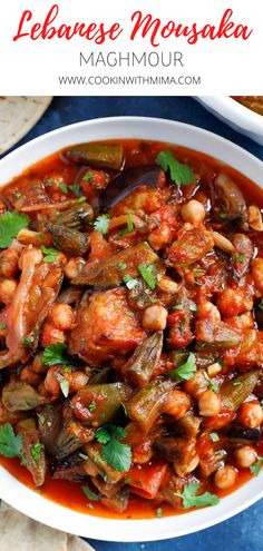 a white bowl filled with stew and garnished with cilantro