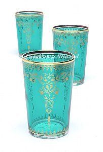 three green glass cups with gold designs on them