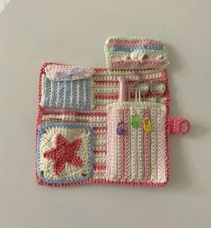 two crocheted purses sitting next to each other