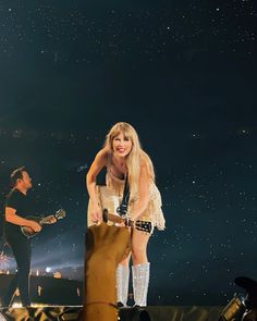 taylor swift performing on stage at the concert