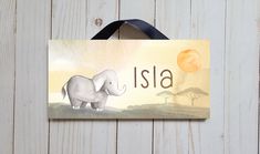 a wooden sign with an elephant on it