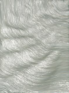 an abstract silver background with wavy lines