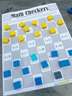 a board game with blue and yellow legos on it, next to the numbers 8 - 9