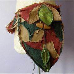 a mannequin head made out of fabric and other items on a dummy's torso