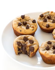 several chocolate chip muffins on a white plate