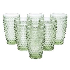 set of six green glass tumblers on white background