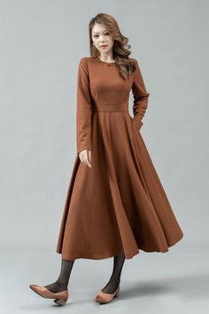 ★★ Welcome to my Ylistyle's shop！！！ This long camel fit and flare wool dress can well show your elegant temperament and taste. Our midi long sleeve wool dress, made of high-quality fabric, giving you a good touch and very comfortable to wear. ★★FEATURES 25% wool, other fiber,nylon Polyester lining Two side pockets Back zipper closure Long sleeves dress Long wool dress Fit and flare dress Dress formal Autumn winter wool dress Dry clean Belt not for sale ★★ More color from Color4 of Wool fabric swatch https://etsy.me/37PMzfD ★★ The model's height approx 170 cm (5′ 7″) with the 84 cm (33") bust, 66 cm (26") waist. She is wearing the wool dress in size XS (US2) ★★Bespoke Order Service Request other color Request the Length Request the sleeve length Your height is not between 155cm- 175cm Your Simple Fall Workwear Dresses, Brown Solid Color Winter Dress, Casual Winter A-line Maxi Dress, Brown Dresses For Winter Workwear, A-line Midi Dress For Winter, Brown Winter Dress For Work, Brown Dress For Work In Winter, Plain Fall Midi Dress, Brown Solid Color Midi Dress For Fall