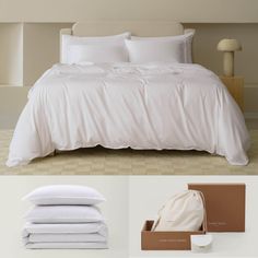 a bed with white sheets and pillows next to a brown box on the floor in front of it