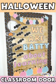 a classroom door decorated for halloween with the words, we are batty about learning