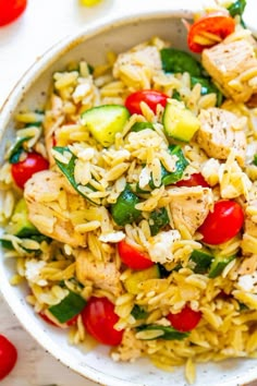 a white bowl filled with rice and vegetables