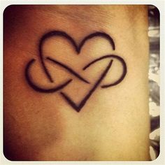 a heart tattoo with two intertwined hearts