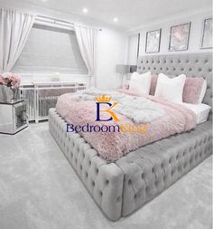 a bedroom with white carpet and pink bedding