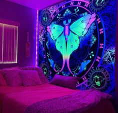 a bedroom with purple and blue lighting in the corner, there is a butterfly mural on the wall