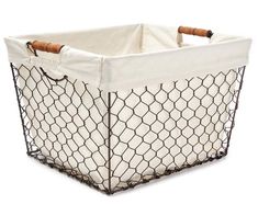 a white and black wire basket with wooden handles