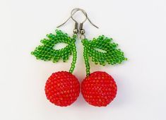 two cherries are made out of beads