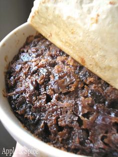 a close up of a bowl of food with bread