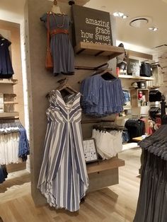 clothes are on display in a clothing store