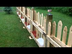 a fence made out of wooden boards with toilet seats