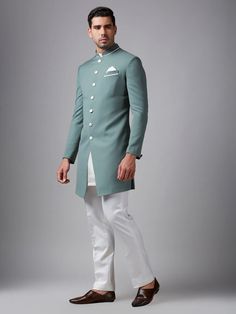 Perfect for party and special occasions, this mint green plain terry rayon indowestern will have you stand out in the crowd. Designed with a mandarin collar, a pocket tie and front button placket. Comes with a bottom. Outfit Festival, Green Plain